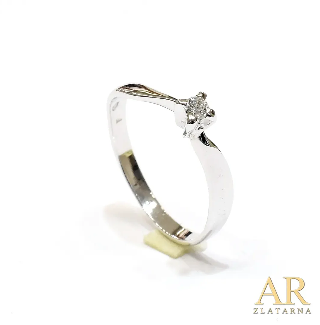 Zlatni zaručnički prsten  bijelo zlato uvijeni s 0.08ct dijamantom u četverokrakoj kruni